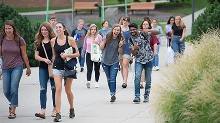 Group of students walking to chapel.